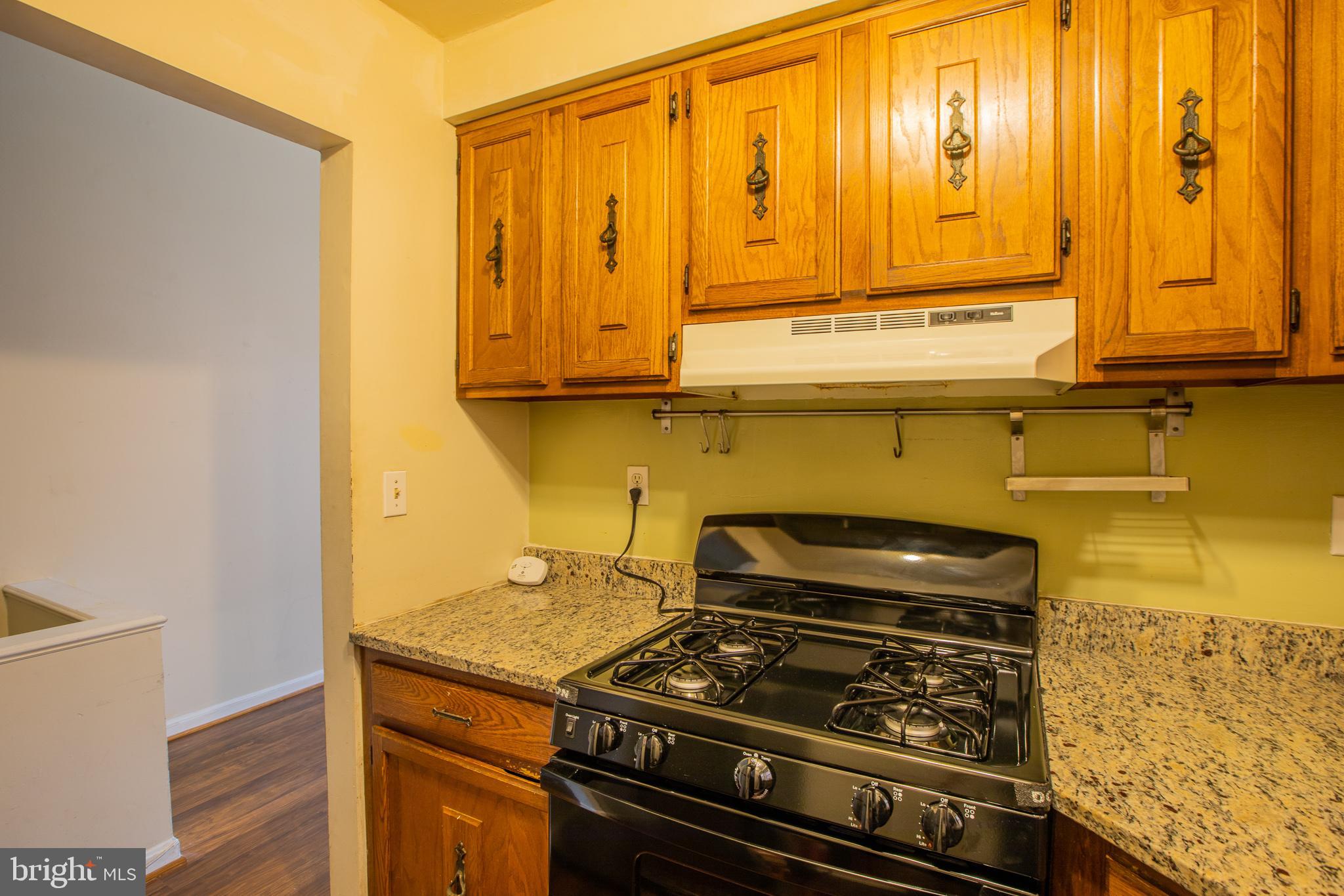 909 R Street Northwest, Unit B Washington, DC 20001 - Photo 14 of 17 a stove top oven sitting inside of a kitchen