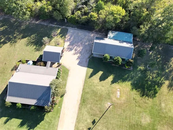 an aerial view of house with yard swimming pool and outdoor seating