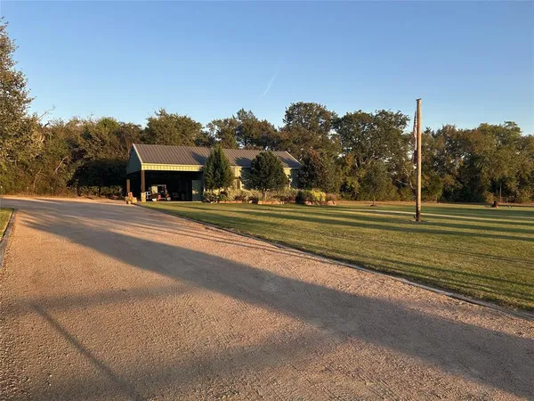 a bedroom with a bed and a tv
