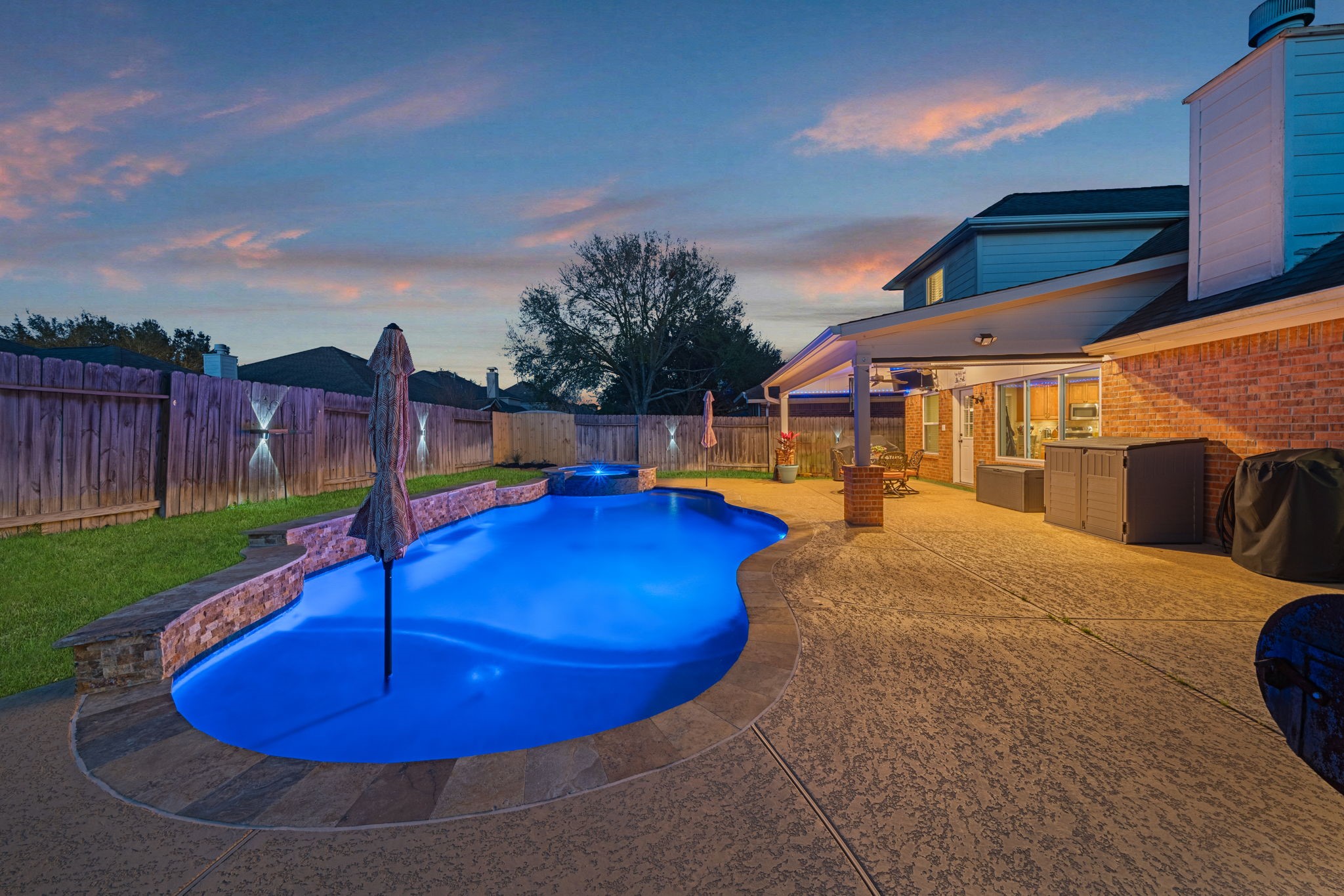 a view of a swimming pool with a patio