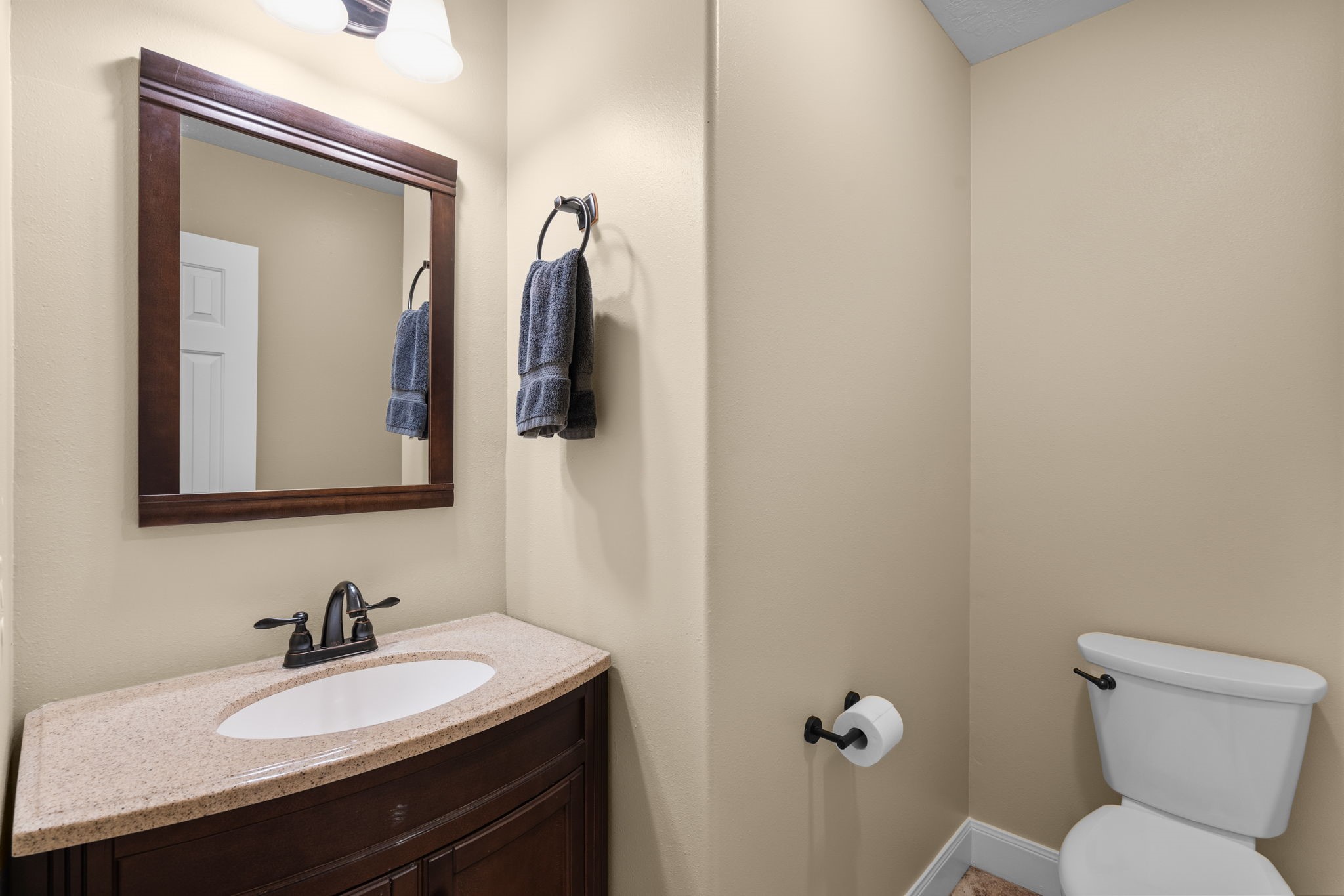 15319 Court Green Trail Cypress, TX 77433 - Photo 17 of 44 a bathroom with a sink vanity mirror and toilet