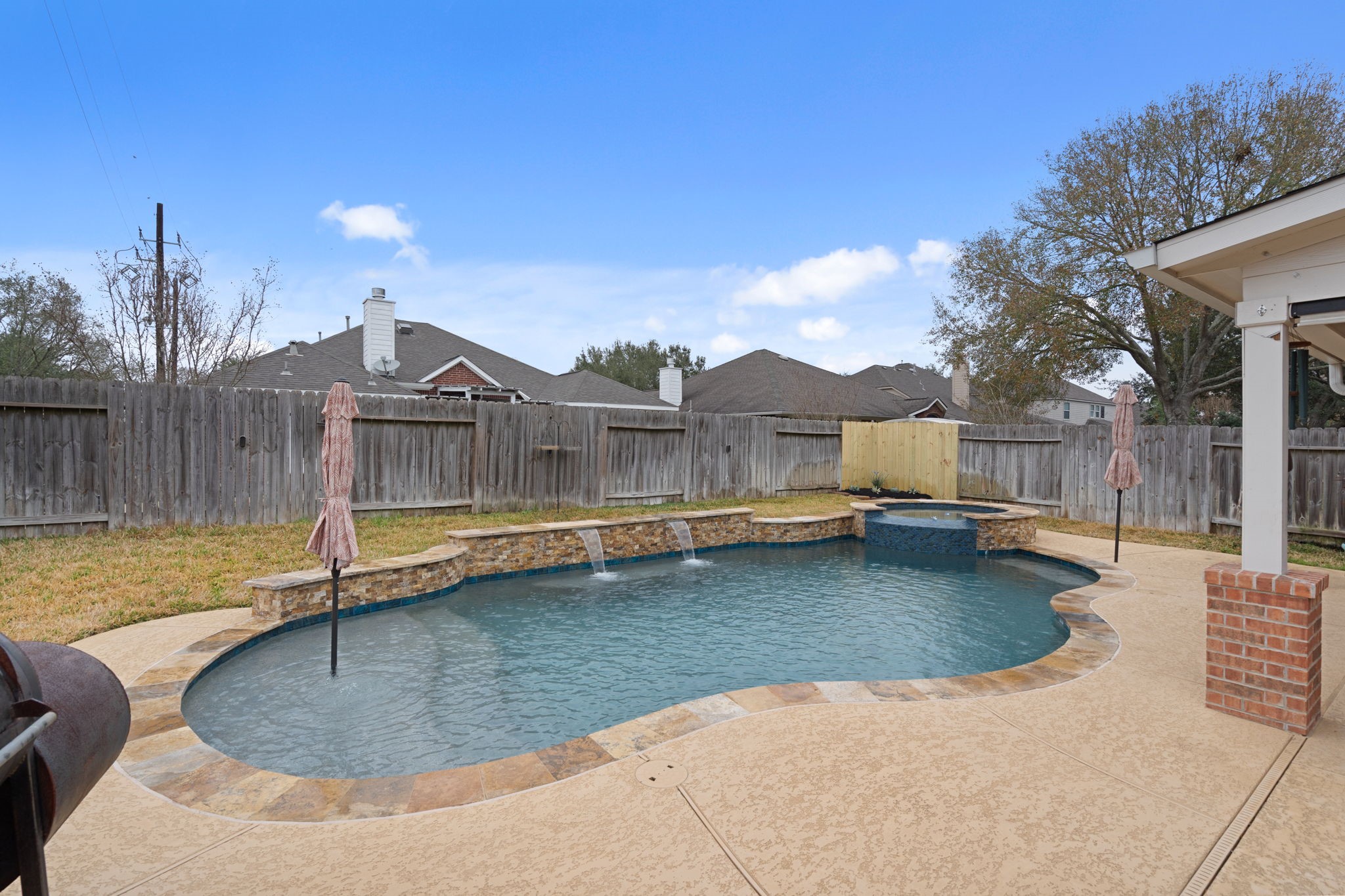 15319 Court Green Trail Cypress, TX 77433 - Photo 34 of 44 a view of a swimming pool with a patio