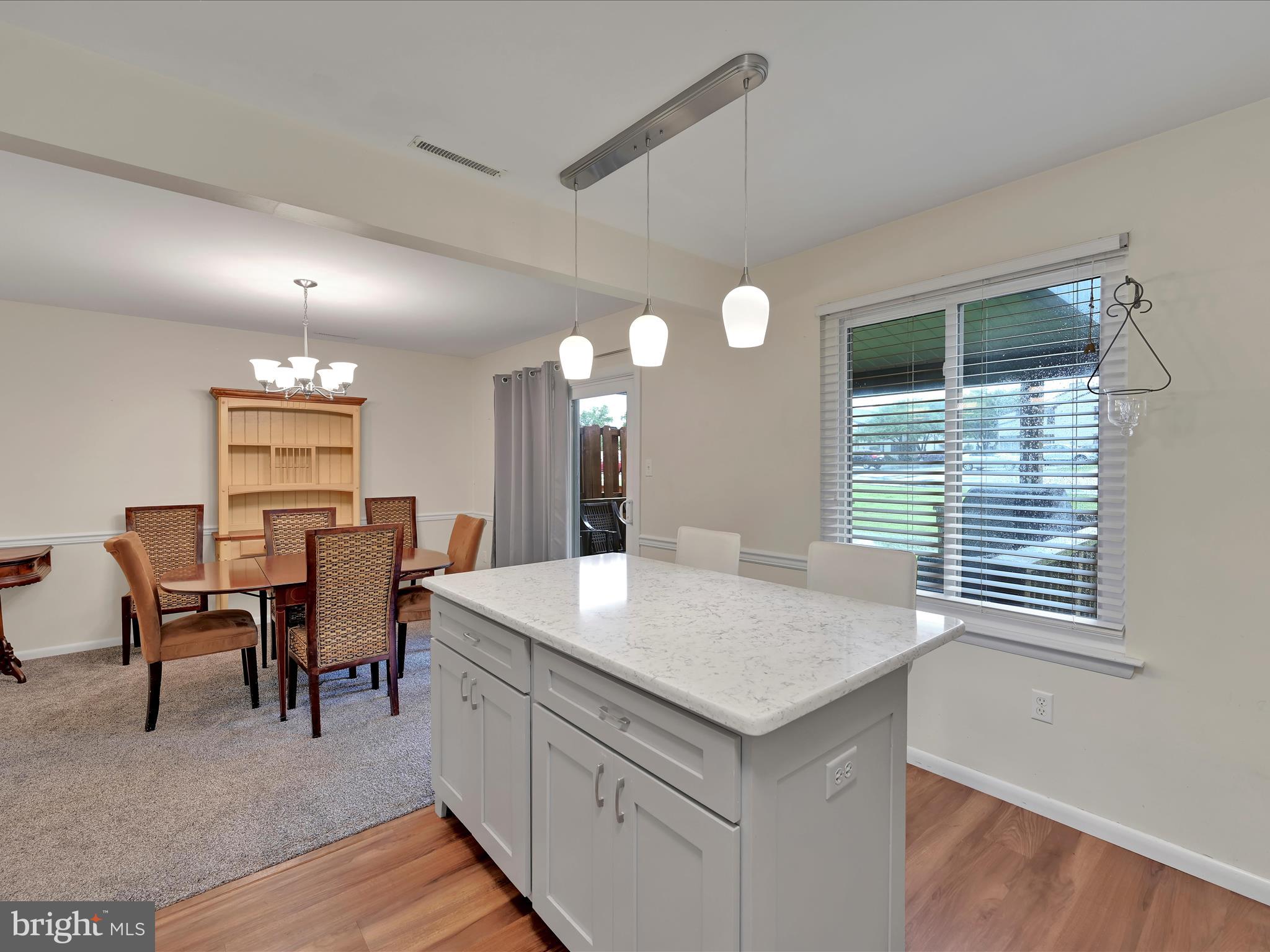 72 Azalea Way Reading, PA 19606 - Photo 12 of 27 a view of kitchen with sink refrigerator dining table and chairs