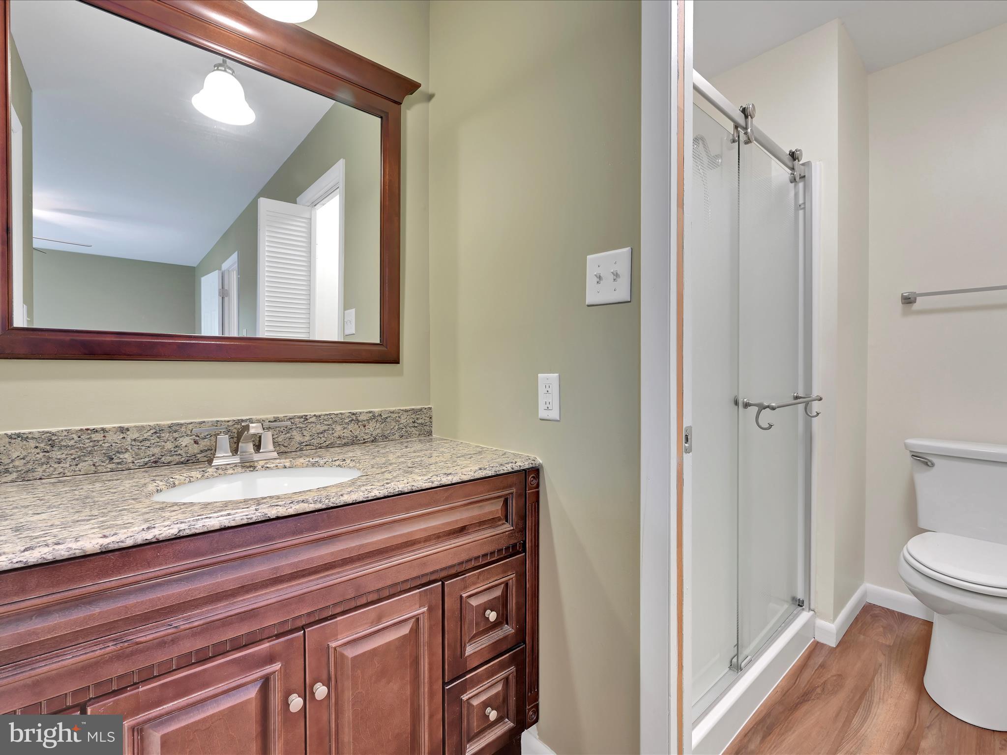 72 Azalea Way Reading, PA 19606 - Photo 19 of 27 a bathroom with a granite countertop sink toilet and shower