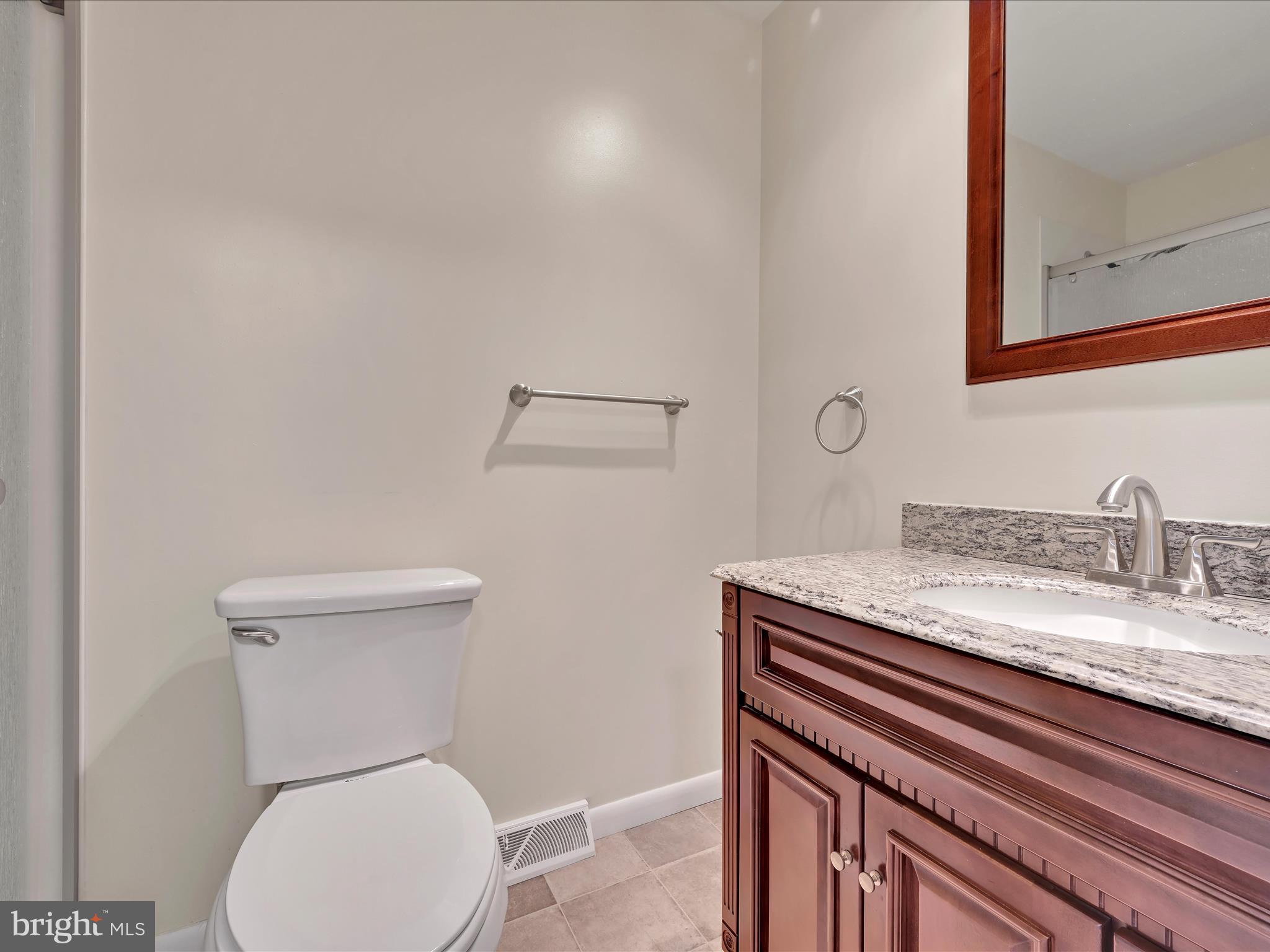 72 Azalea Way Reading, PA 19606 - Photo 22 of 27 a white toilet sitting next to a bathroom sink