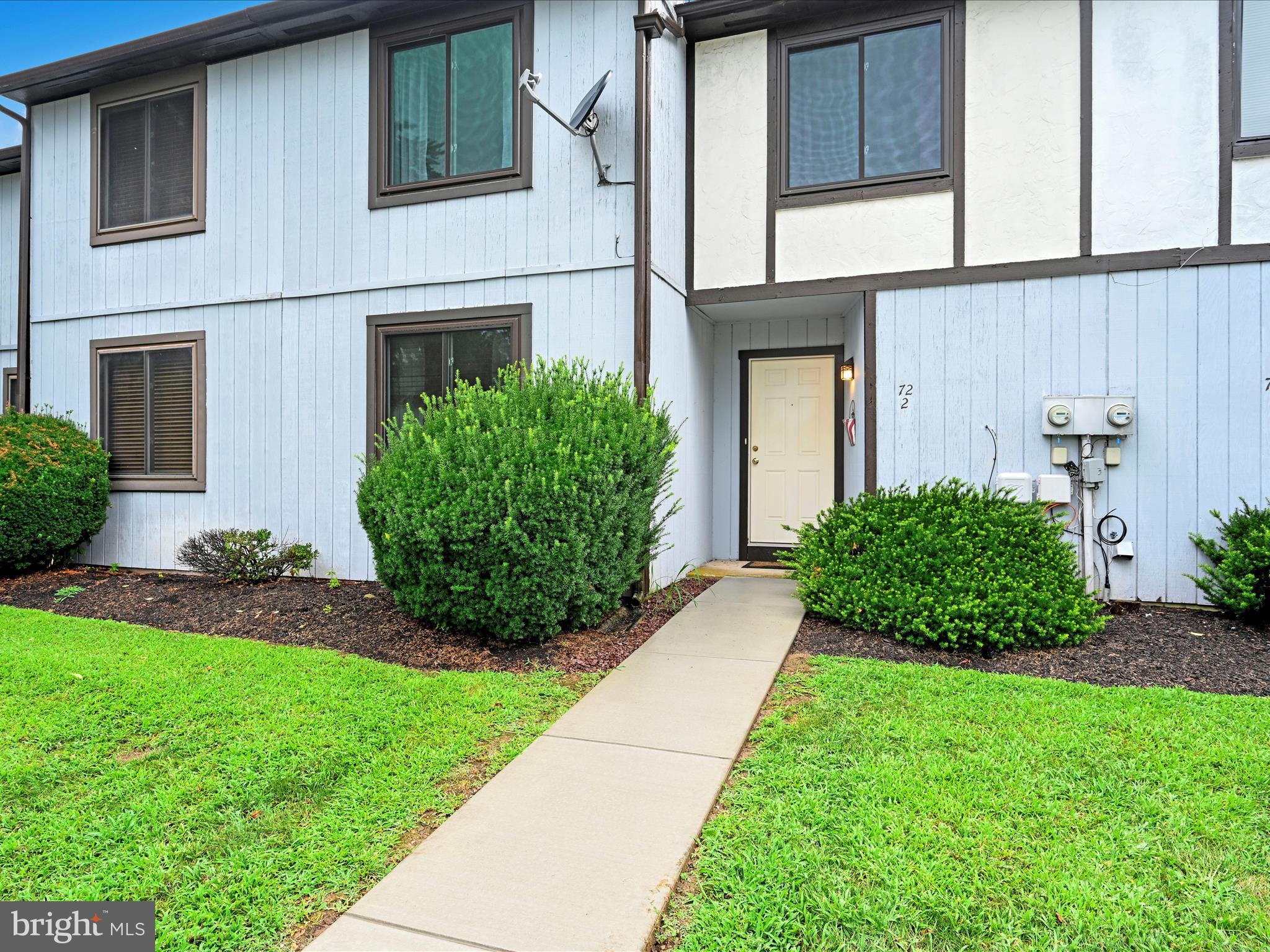 72 Azalea Way Reading, PA 19606 - Photo 3 of 27 front view of a house with a yard