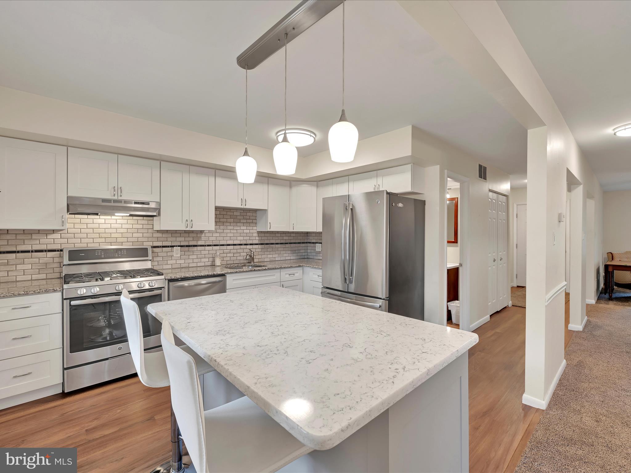 72 Azalea Way Reading, PA 19606 - Photo 10 of 27 a kitchen with stainless steel appliances granite countertop a sink a stove and a refrigerator