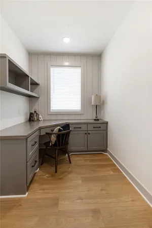 a kitchen with a sink cabinets and window