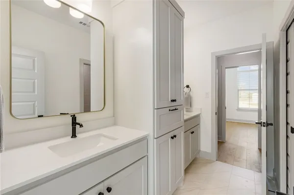 a white toilet sitting next to a bath tub