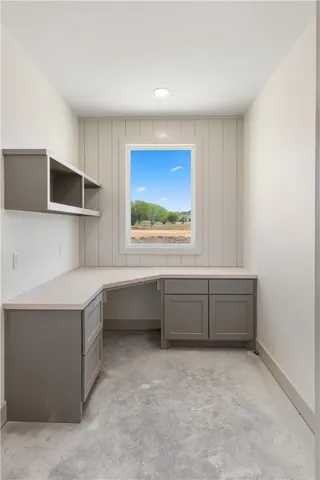 a kitchen with cabinets a window and a sink