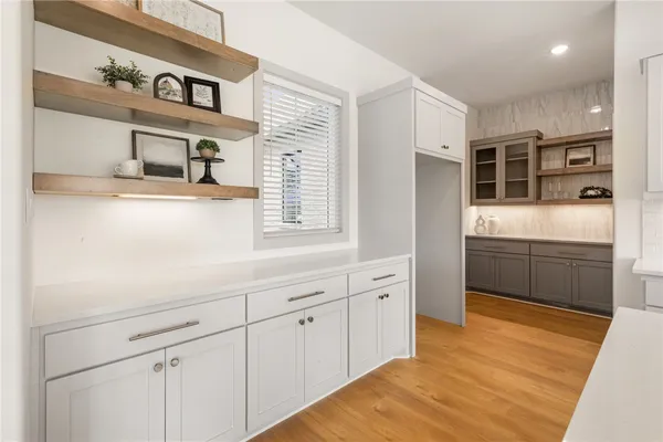 a kitchen with stainless steel appliances a sink and cabinets