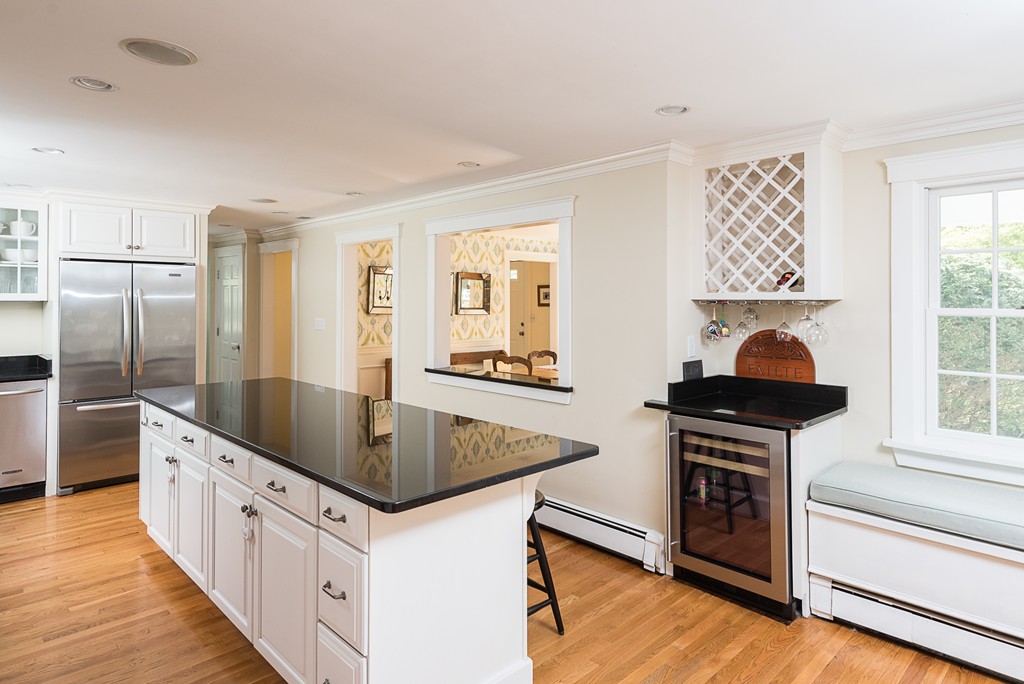 35 Stanford Drive Westwood, MA 02090 - Photo 12 of 29 a kitchen with stainless steel appliances granite countertop a sink stove and refrigerator