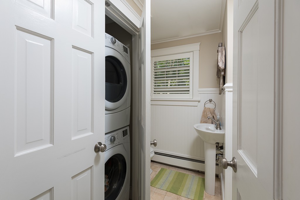 35 Stanford Drive Westwood, MA 02090 - Photo 18 of 29 a view of a storage and utility room with washer and dryer