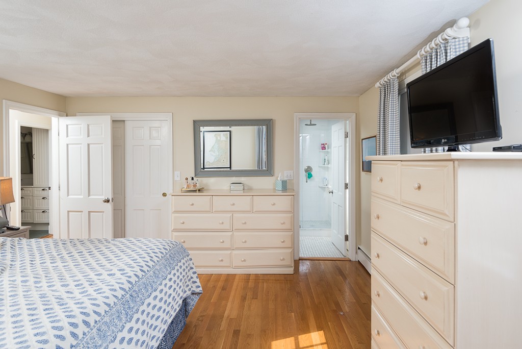 35 Stanford Drive Westwood, MA 02090 - Photo 23 of 29 a bed room with a flat screen tv and a bed