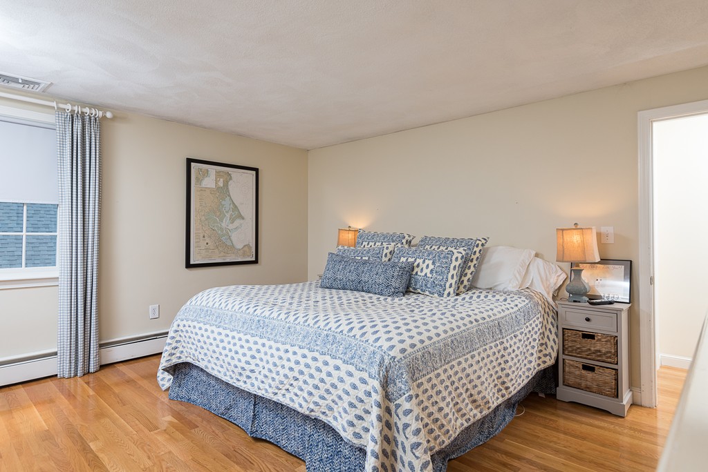 35 Stanford Drive Westwood, MA 02090 - Photo 24 of 29 a bedroom with a bed and wooden floor