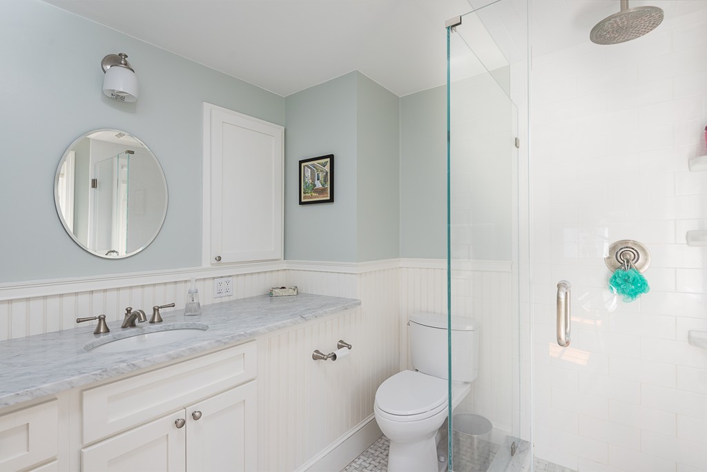 35 Stanford Drive Westwood, MA 02090 - Photo 25 of 29 a bathroom with a granite countertop sink and a mirror