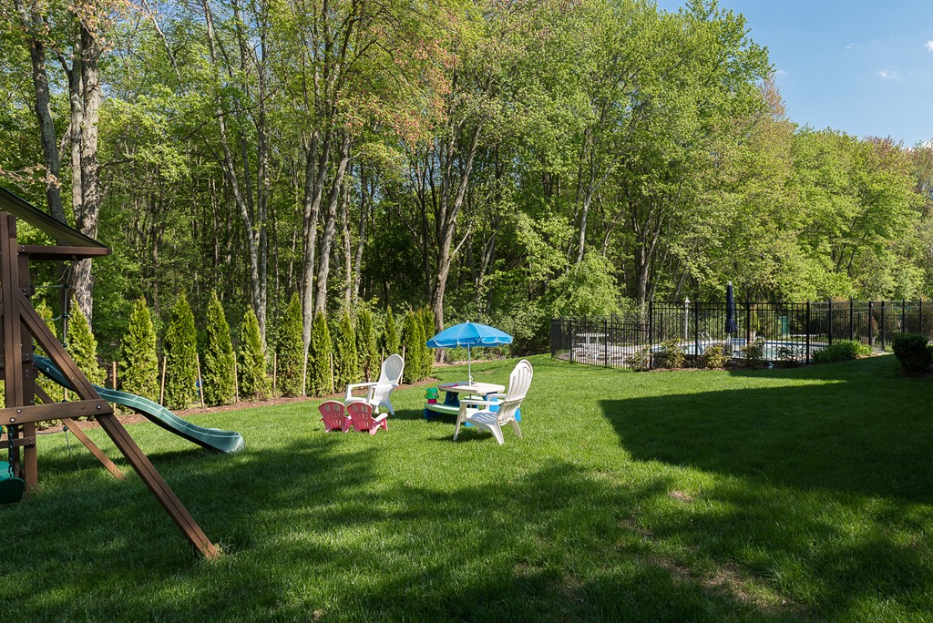 35 Stanford Drive Westwood, MA 02090 - Photo 27 of 29 a play ground with trees in the background