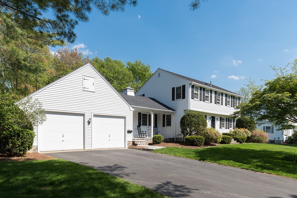 35 Stanford Drive Westwood, MA 02090 - Photo 29 of 29 a front view of a house with a yard and garage