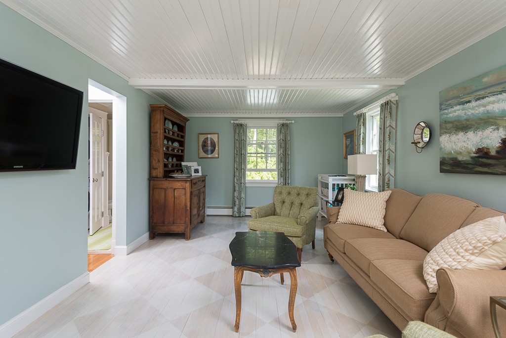 35 Stanford Drive Westwood, MA 02090 - Photo 3 of 29 a living room with furniture and a flat screen tv