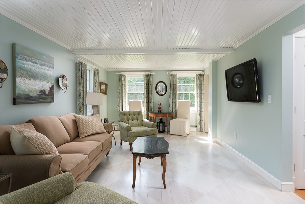 35 Stanford Drive Westwood, MA 02090 - Photo 4 of 29 a living room with furniture and a flat screen tv