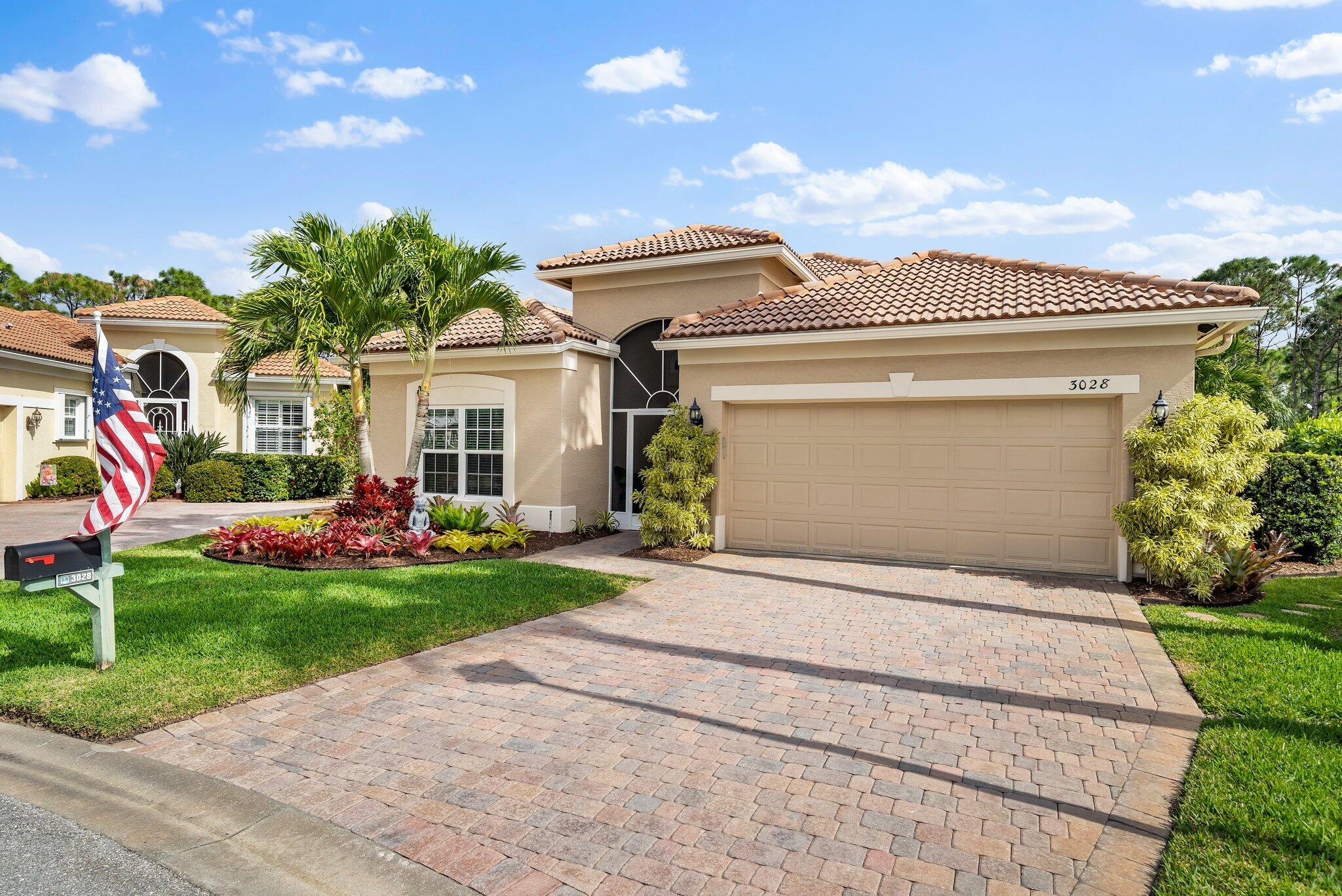 3028 Southeast Racoon Way Stuart, FL 34997 - Photo 3 of 50 Front of Garage w/ Drive