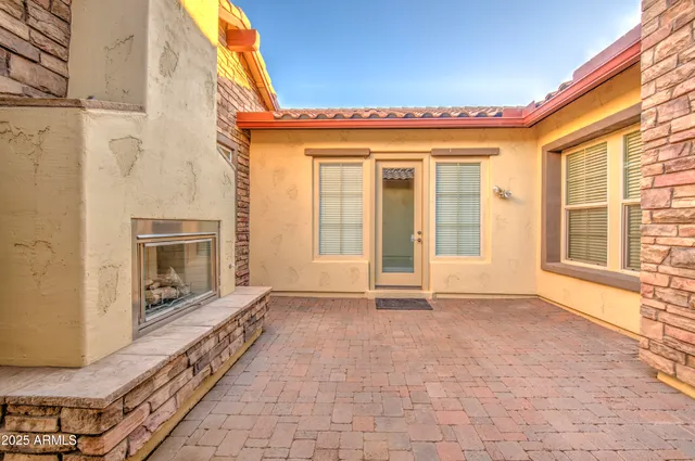 a view of an entrance to house with yard