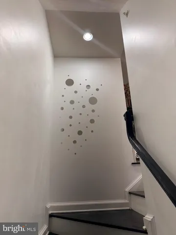 a view of kitchen with dining room and wooden floor