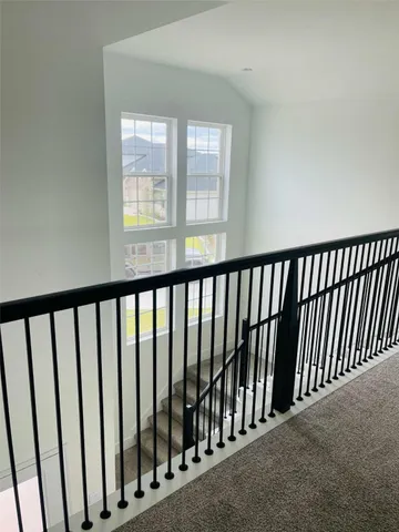 a view of a hallway with windows
