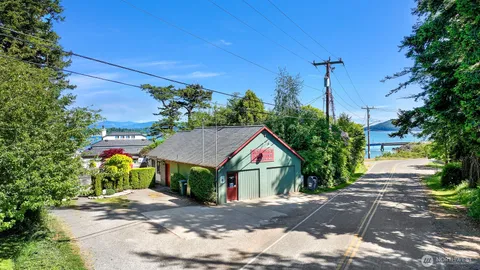 an aerial view of a house with yard