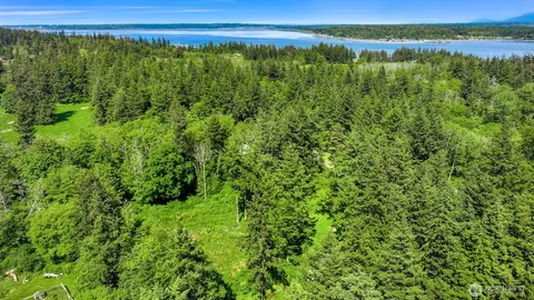 a view of a lake with a yard