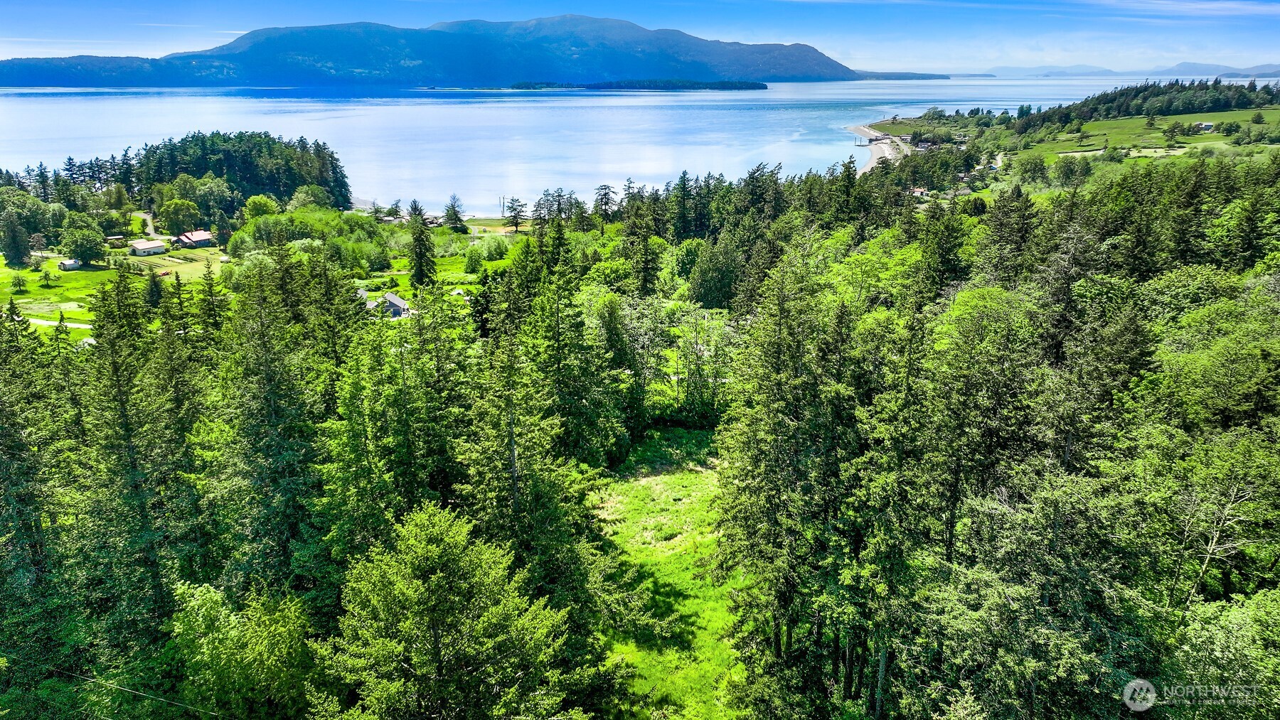2093 Granger Way Lummi Island, WA 98262 - Photo 9 of 35 a view of a lake with a yard