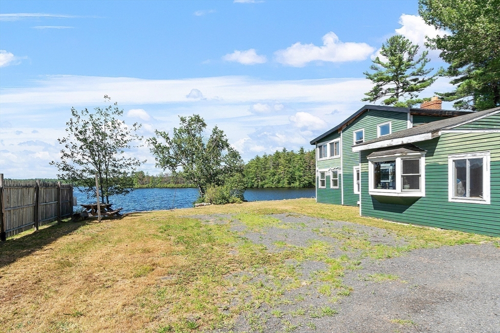 6 Wyman Road Ashburnham, MA 01430 - Photo 14 of 39 a view of a house with a yard and potted plants