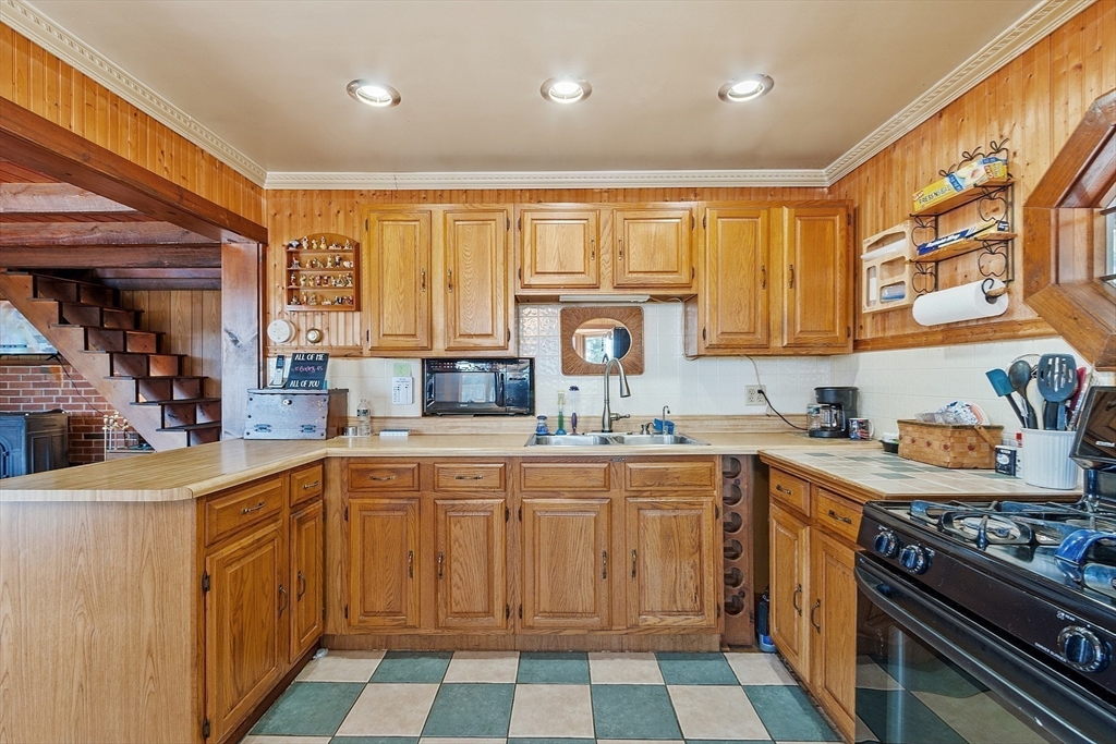 6 Wyman Road Ashburnham, MA 01430 - Photo 25 of 39 a kitchen with a sink stove and cabinets
