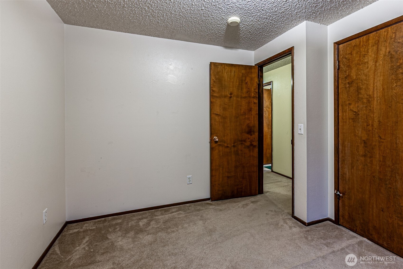 7505 Husky Way Southeast Lacey, WA 98503 - Photo 25 of 40 an empty room with sliding door