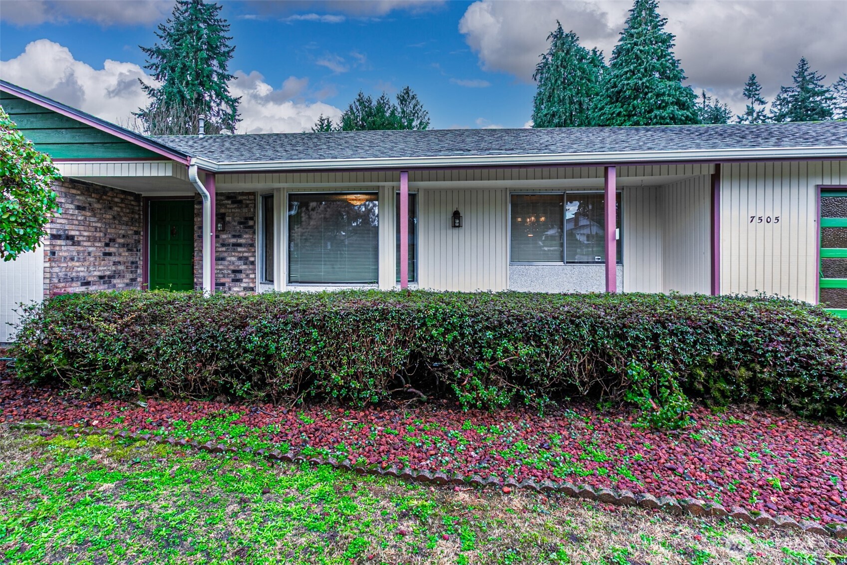 7505 Husky Way Southeast Lacey, WA 98503 - Photo 5 of 40 a front view of a house with a yard