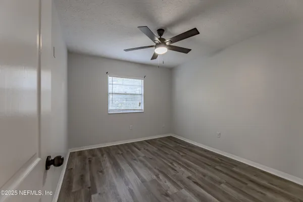 a bathroom with a sink toilet vanity and shower