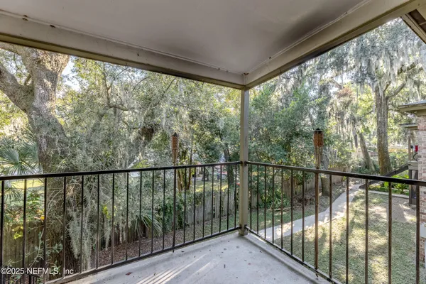 a view of balcony with furniture