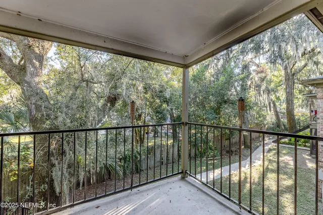 a view of balcony with furniture