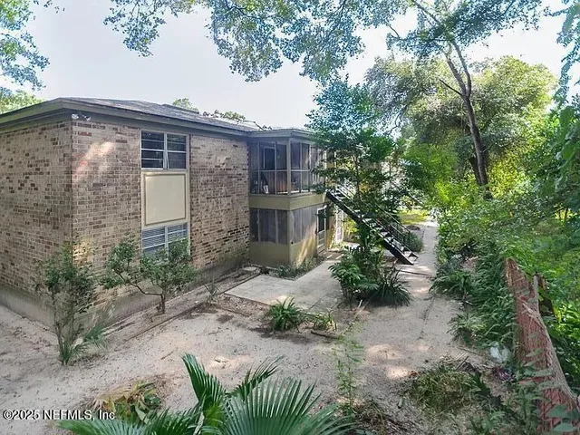 swimming pool view with a seating space