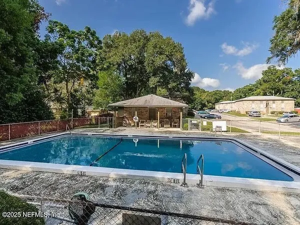 a view of a patio with swimming pool