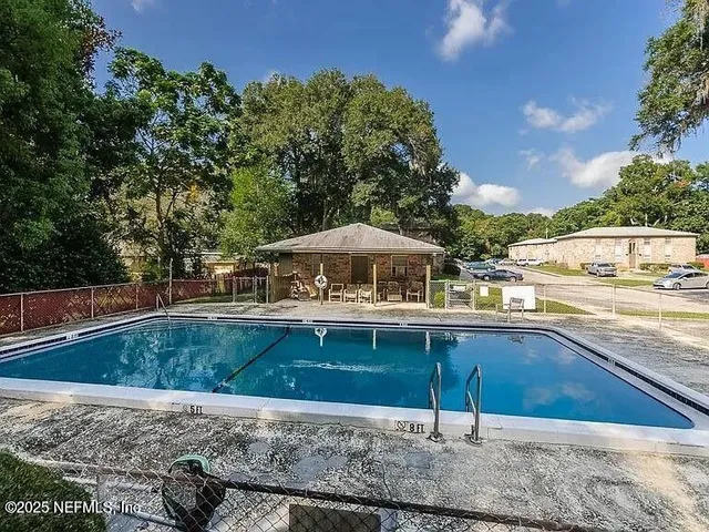 a view of a patio with swimming pool