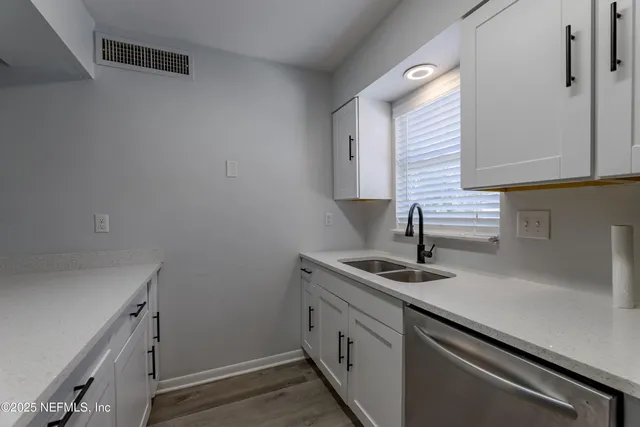 a kitchen with a stove and a refrigerator