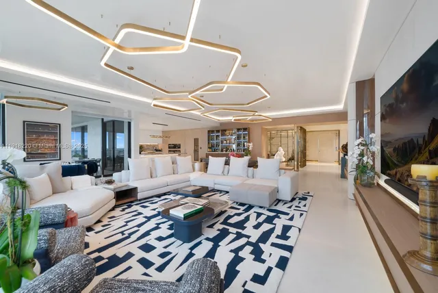 a living room with furniture fireplace and flat screen tv