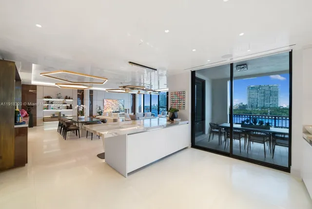 a large white kitchen with lots of counter top space