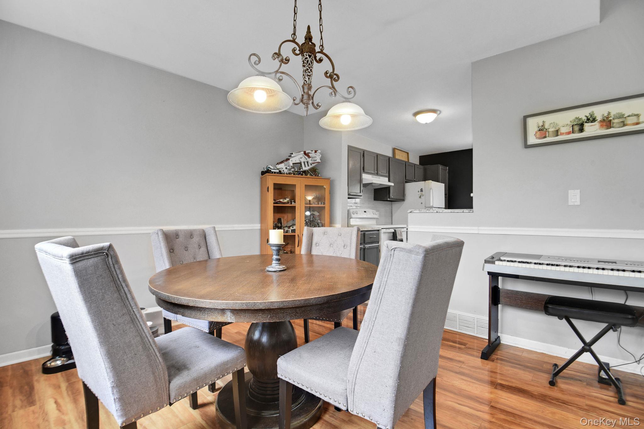 805 Eagles Ridge Road Brewster, NY 10509 - Photo 7 of 22 a view of a dining room with furniture and wooden floor