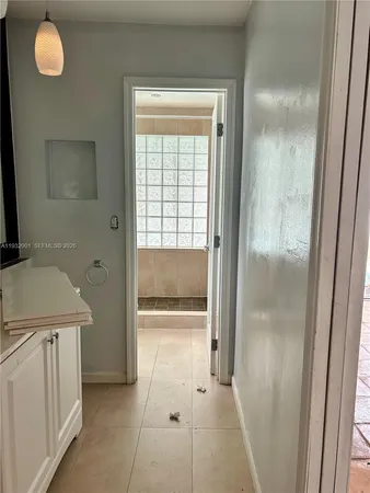 a bathroom with a tub and shower