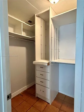 a view of an empty walk in closet
