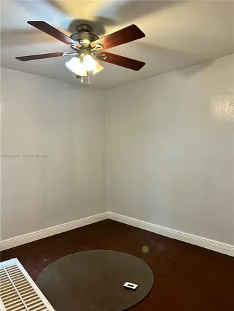 a view of a small space with wooden floor