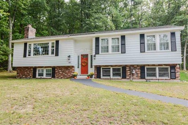 4 Belknap Road Hudson, NH 03051 - Photo 1 of 30 a view of a house with a yard and sitting space