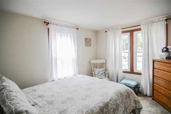 4 Belknap Road Hudson, NH 03051 - Photo 20 of 30 a bedroom with a large bed and a window